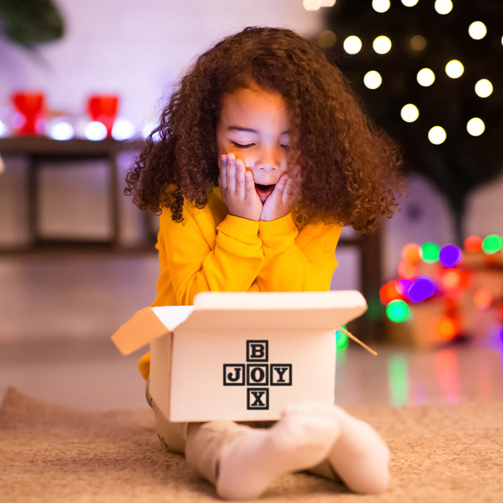 Girl with CaringKids Joy Box