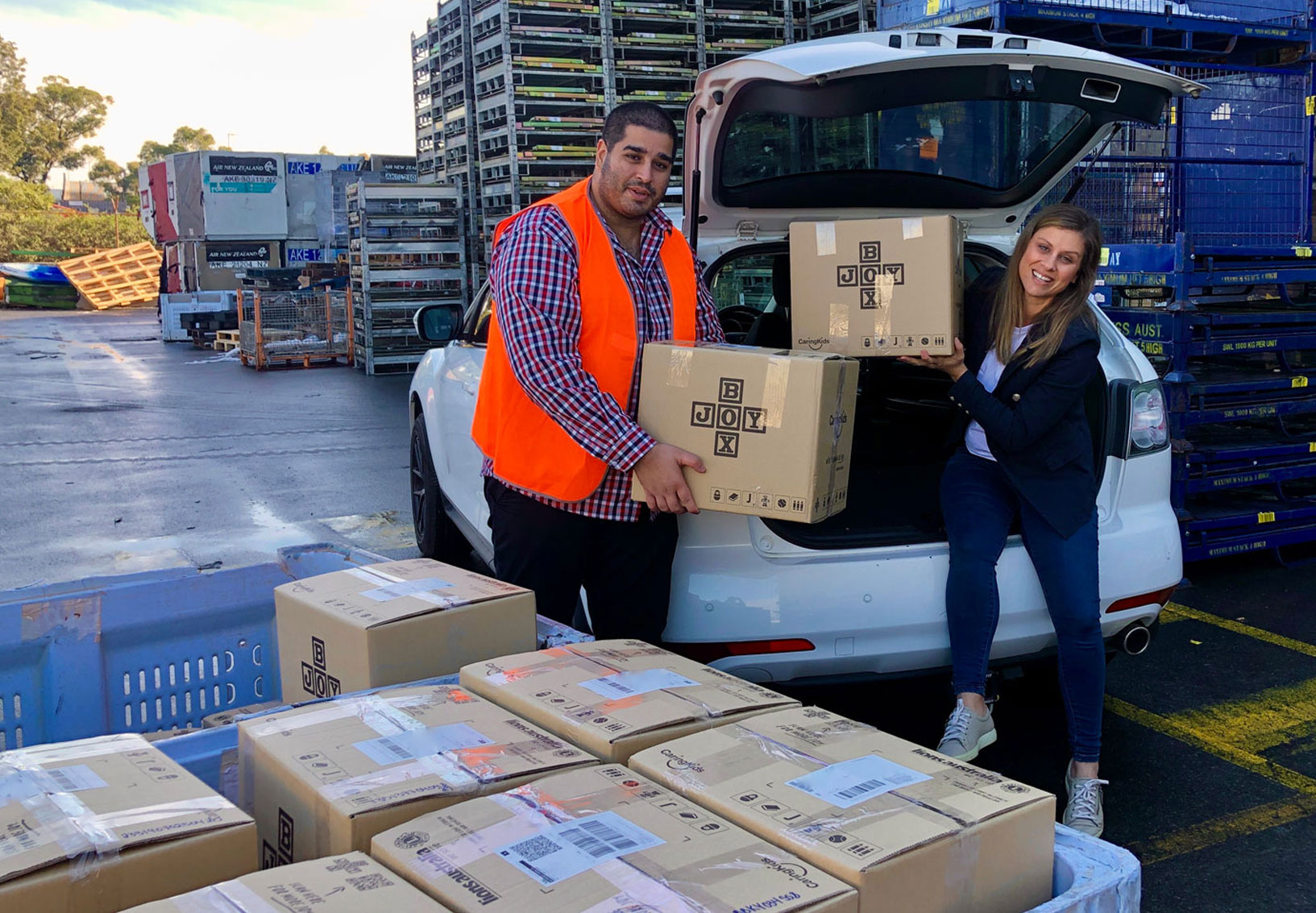 SEKO Logistics unloading CaringKids Joy Boxes